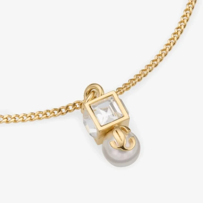 Brățară Jc Pearl Cube Brățară din metal auriu cu perle și cuburi de cristal Brățară Jc Pearl Cube Brățară din metal auriu cu perle și cuburi de cristal