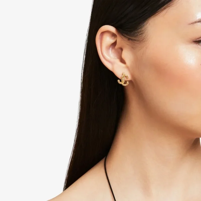 Cercei Jc Studs din metal cu finisaj auriu și cristale Swarovski