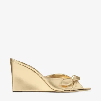 Livi Wedge 85 Mule din piele nappa auriu metalizat cu toc înalt și fundă Livi Wedge 85 Mule din piele nappa auriu metalizat cu toc înalt și fundă