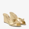 Livi Wedge 85 Mule din piele nappa auriu metalizat cu toc înalt și fundă Livi Wedge 85 Mule din piele nappa auriu metalizat cu toc înalt și fundă