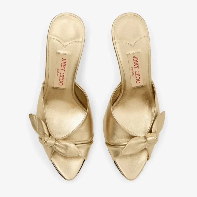 Livi Wedge 85 Mule din piele nappa auriu metalizat cu toc înalt și fundă Livi Wedge 85 Mule din piele nappa auriu metalizat cu toc înalt și fundă