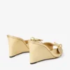 Livi Wedge 85 Mule din piele nappa auriu metalizat cu toc înalt și fundă Livi Wedge 85 Mule din piele nappa auriu metalizat cu toc înalt și fundă