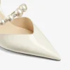 Pantofi cu vârf ascuțit Aurelie 65 din piele lăcuită Latte, cu ornamente din perle Pantofi cu vârf ascuțit Aurelie 65 din piele lăcuită Latte, cu ornamente din perle