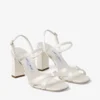Sandale Elsy cu toc gros de 85 mm din satin de culoare ivoriu, cu cataramă împodobită cu cristale Sandale Elsy cu toc gros de 85 mm din satin de culoare ivoriu, cu cataramă împodobită cu cristale