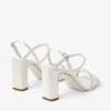 Sandale Elsy cu toc gros de 85 mm din satin de culoare ivoriu, cu cataramă împodobită cu cristale Sandale Elsy cu toc gros de 85 mm din satin de culoare ivoriu, cu cataramă împodobită cu cristale